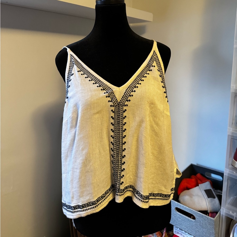 white tank with navy blue design. from ASTR the label. size small